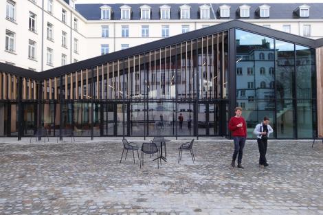 New courtyard with in situ reused cobble stones